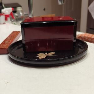 Elegant Black and Red Lacquered Box with Gold Leaf Design